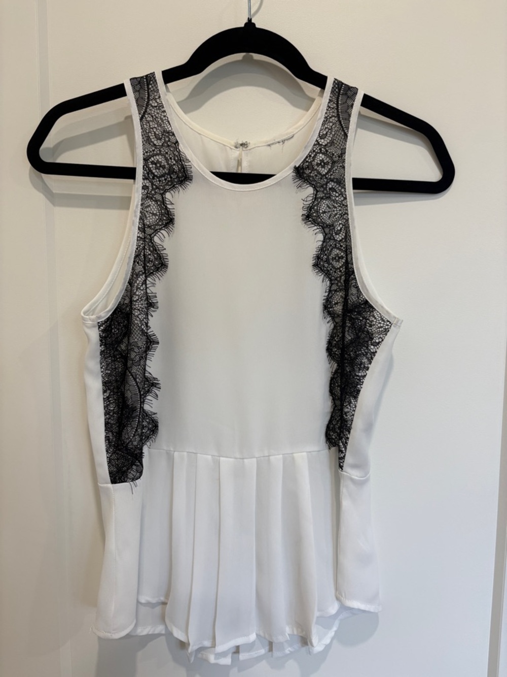 White Sleeveless Peplum Top with Black Lace Trim